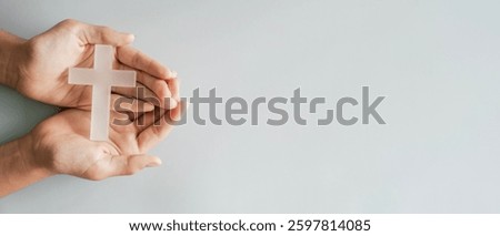 Hands holding white cross, Easter worship, thanks giving, prayer concept