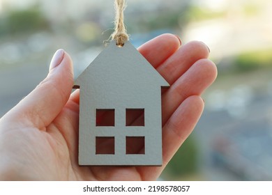 Hands Holding Wooden House, Family Home, Homeless Shelter And Real Estate, Housing And Mortgage Crisis, Foster Home, Family Kindergarten, Social Distancing