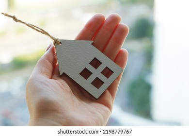 Hands Holding Wooden House, Family Home, Homeless Shelter And Real Estate, Housing And Mortgage Crisis, Foster Home, Family Kindergarten, Social Distancing