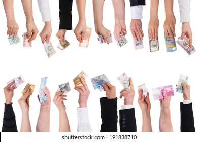 a lot of hands with important currencies isolated on white