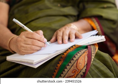 Hands Of Indian Woman Writing A Letter