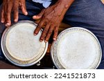 Hands and istrument of musician playing bongo in the streets of Pelourinho in Salvador in Bahia