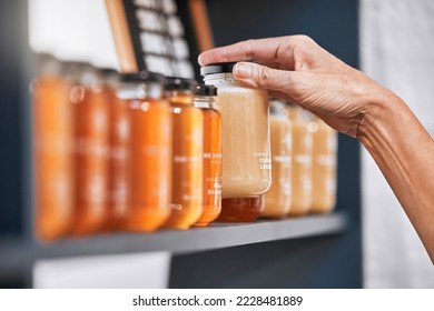 Hands, jar and honey shelf for inventory check, product pricing or labeling in organic retail store. Hand in small business, management or market advertising of healthy glass food products for sale - Powered by Shutterstock