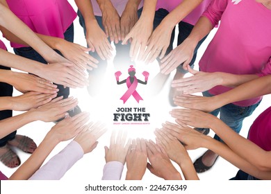 Hands joined in circle wearing pink for breast cancer against breast cancer awareness message - Shutterstock ID 224676349