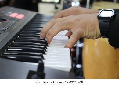hands keyboard instument playing music