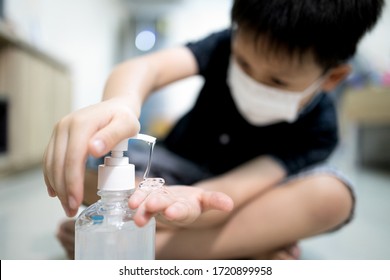 Hands of kid boy with alcohol antiseptic gel,wash hands with hand sanitizer,kill germs,bacteria,viruses,asian child wearing face mask,cleaning,disinfection,prevent infection of Covid-19,Coronavirus - Powered by Shutterstock