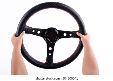 Hands Kid On A Steering Wheel  On  White