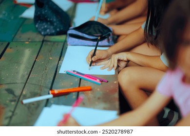 
Hands of Kids Holding Colored Crayons Ready to Draw Creatively. Children ready to illustrate some creative ideas at a workshop
 - Powered by Shutterstock