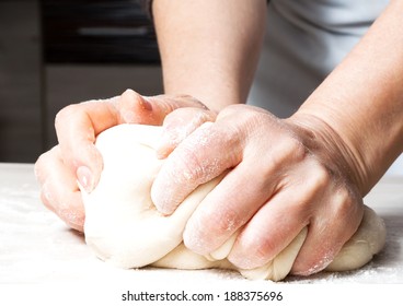 Hands Kneading A Dough