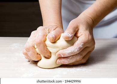 Hands Kneading A Dough