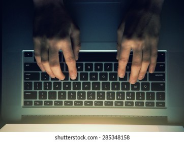 hands with laptop above typing in night - Powered by Shutterstock