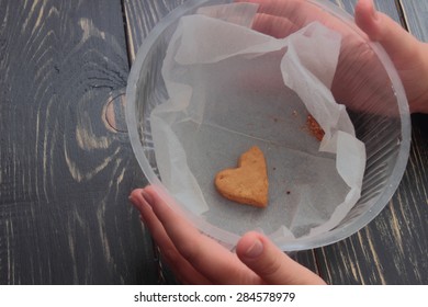 In The Hands Of The Last Cookie In The Box