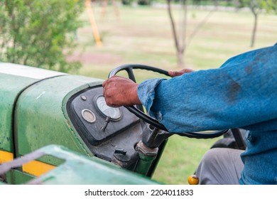 The Hands Of A Latin Man Who Works In The Field Or In Rural Areas Driving A Tractor Doing Agriculture Work.