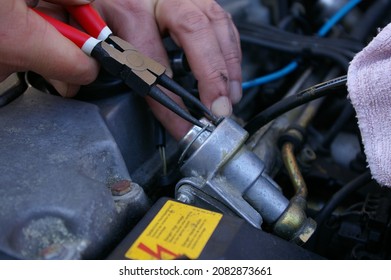 Hands with long nose snap ring pliers tool designed to remove or install internal snap rings. Repairing the injector pump. - Shutterstock ID 2082873661