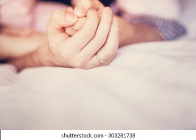 Hands of lovers or honeymooners compressed, closeup, love, relationships, intimacy - Shutterstock ID 303281738