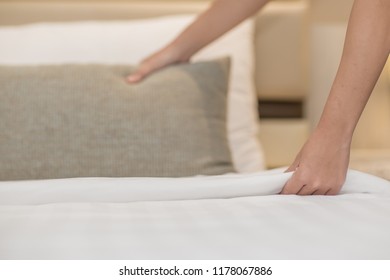 Hands Making Bed from Hotel Room Service - Shutterstock ID 1178067886