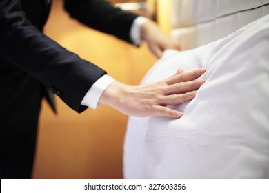 Hands Making Bed From Hotel Room Service