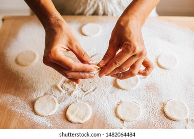 Hands Making Dumplings With Cottage Cheese