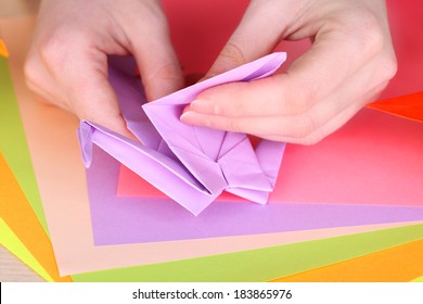 Hands Making Origami Crane, Close Up