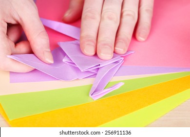 Hands Making Origami Crane, Close Up