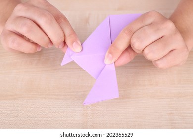 Hands Making Origami Figure, Close Up