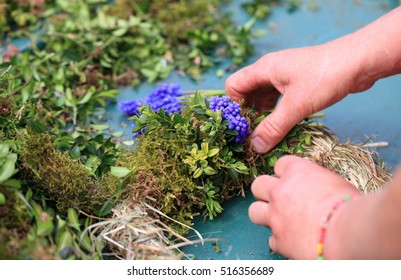 Hands Making A Spring Wreath