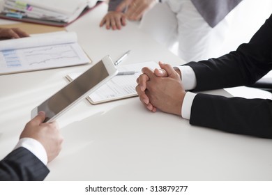 The hands of male employees with tablet - Shutterstock ID 313879277