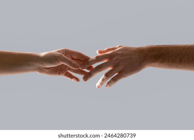 Hands of male and female holding together. Woman and man holding hands together. Giving a helping hand to another. Woman and man hand. Hands man and woman reaching to each other, support. - Powered by Shutterstock