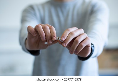 Hands Man Break A Cigarette Close-up And  Smoking Harm Concept