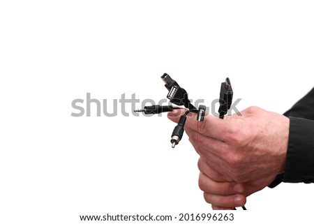 in the hands of a man, a bunch of different cables of computer connectors. isolated on a white background. mock up