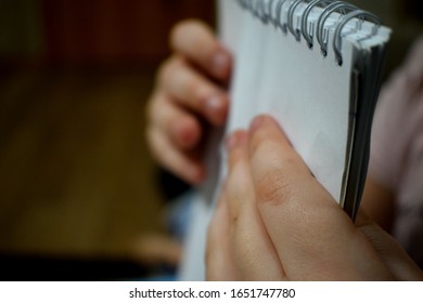 hands of a man with a Notepad