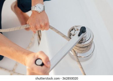 Hands Of Man On A Yacht Pulling Rope