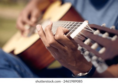 Hands, man and playing guitar in garden for music, sound and performance in nature. Male person, musician and instrument in backyard for practice, production and rehearsal for talent show in park - Powered by Shutterstock