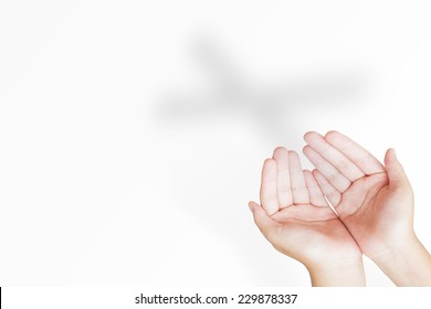 Hands Of Man Praying Over The Cross Shadow On White Background