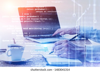 Hands of man typing on laptop and writing with double exposure of lines of code. Concept of programming and software development. Toned image - Shutterstock ID 1483041314
