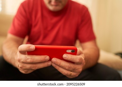 hands of a man using smartphone