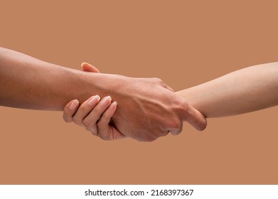 Hands of a man and woman at the time of rescue, isolated on brown backgrounds, Concept of salvation.  - Shutterstock ID 2168397367