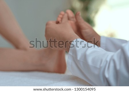   hands massage the foot                                    