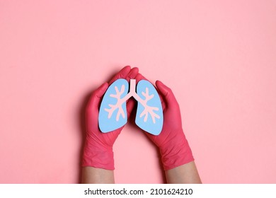 Hands With Medical Gloves Hold A Lungs Symbol On Pink Background. World Tuberculosis Day. Healthcare, Medicine, Hospital, Diagnostic, Internal Donor Organ.