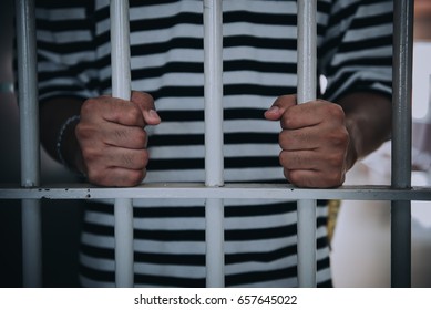 Hands of men desperate to catch the iron prison,prisoner concept