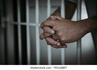Hands of men desperate to catch the iron prison,prisoner concept,thailand people,Hope to be free. - Shutterstock ID 795124897