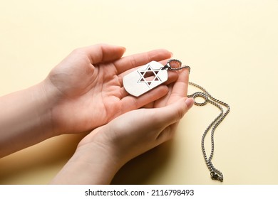 Hands With Military Tag Of Israeli Soldier On Color Background