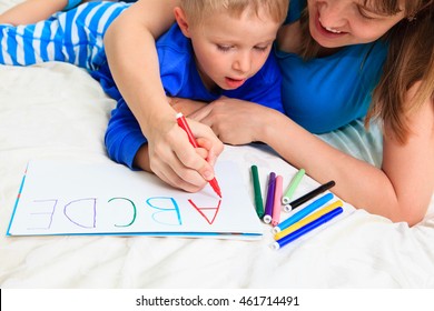 Hands Of Mother And Child Writing Letters