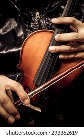 Hands Of Musician In Black Jacket Playing Classical Violin