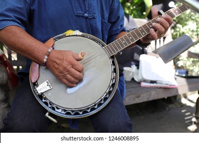 Hands Of Musician Playing Banjo