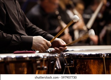  Hands Musician Playing The Timpani In The Orchestra Closeup In Dark Colors