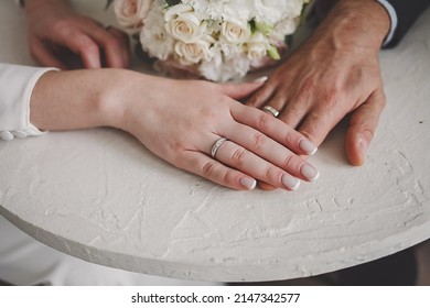 the hands of the newlyweds. Golden ring for bride and groom. wedding,
