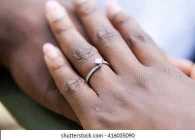 Hands Of An Nigerian Couple. She Is Wearing An Engagement Ring. 