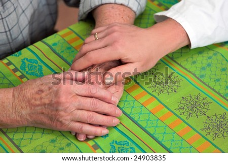 Hands nurse and an old woman