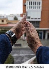 Hands Of Old Man Clapping In Balcony POV